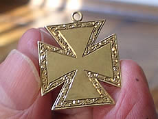 Mr Victor Burger's miniture Burgers Cross, made from the last gold mined at Pilgrims Rest